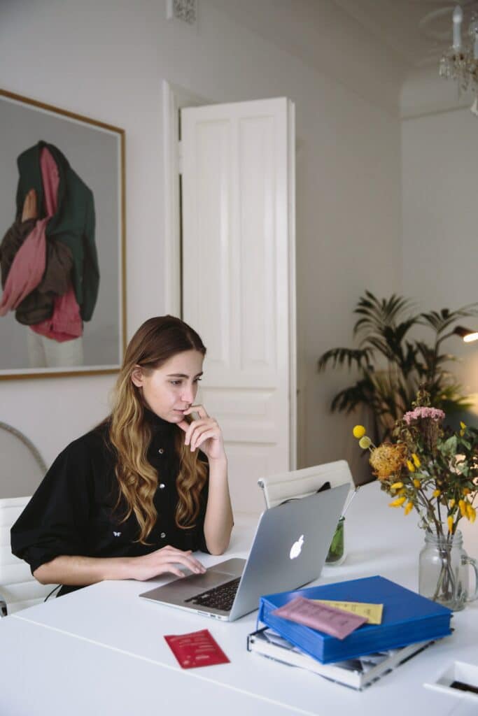 A virtual assistant working from home on her laptop