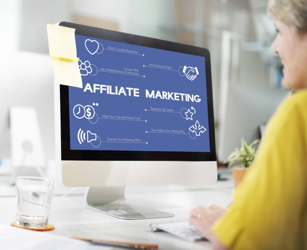 A woman doing affiliate marketing on her desktop