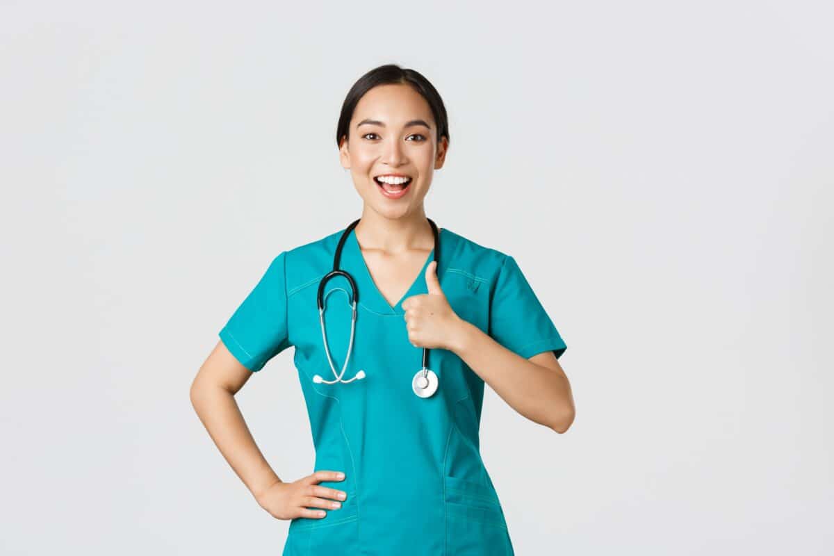 https://scholaroo.com/wp-content/uploads/2023/01/covid19-healthcare-workers-pandemic-concept-smiling-upbeat-confident-female-asian-nurse-scrubs-have-all-control-show-thumbsup-approval-guarantee-quality-service-clinic-min-1200x800.jpg